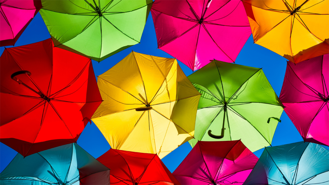 Colorful umbrellas banner for Reva blog post.